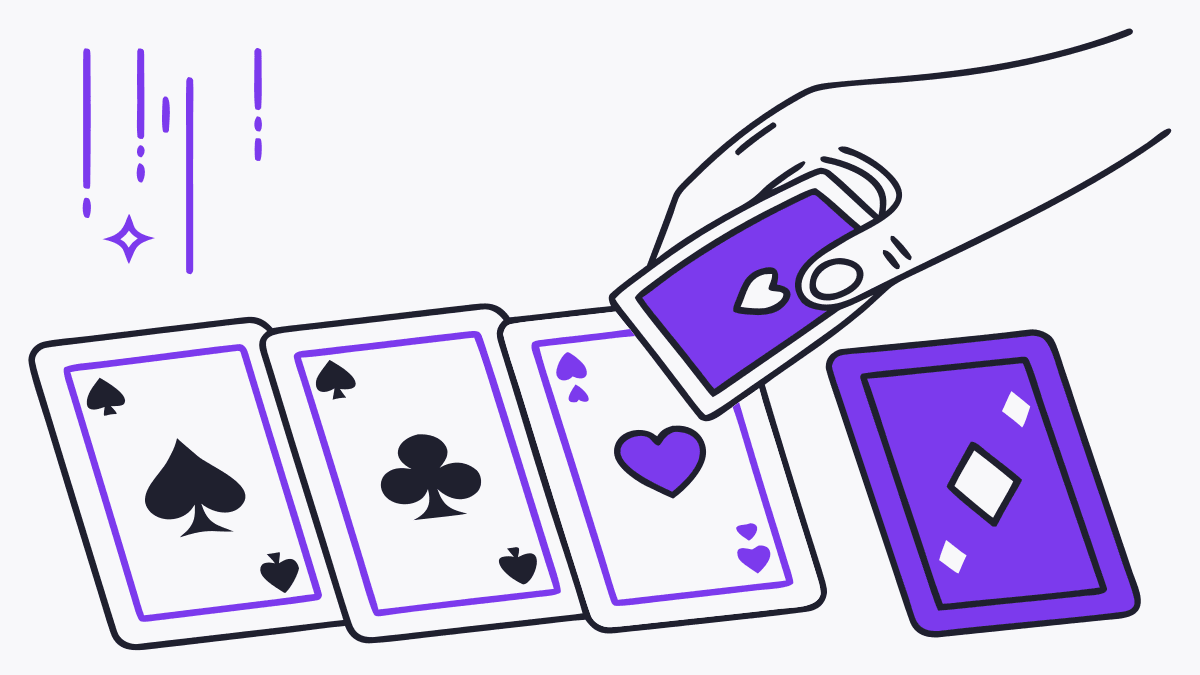 A hand picking one card from a row of face-down cards